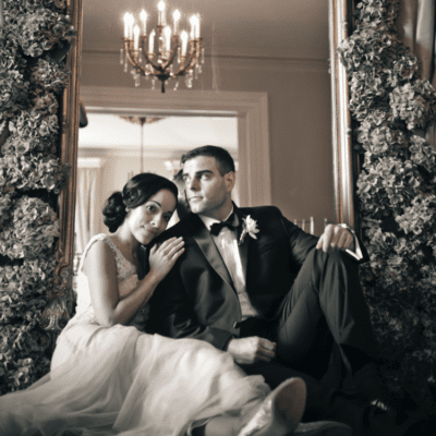 bride and groom embracing on couch