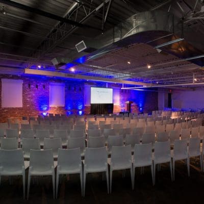 event space with lots of chairs and a podium