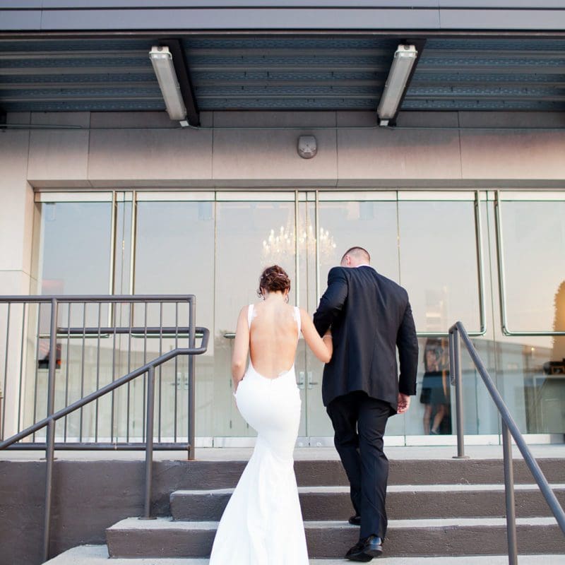 exterior image of venue with bride and groom