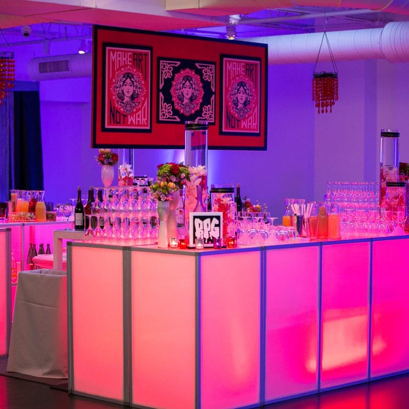 beautiful event space with low lighting and a bar
