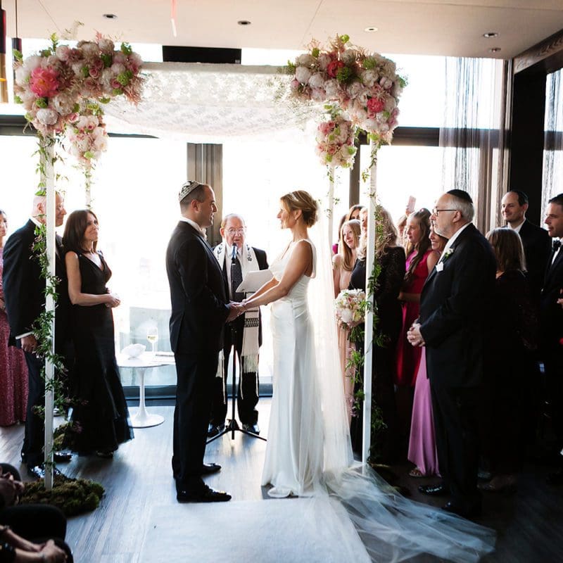 a wedding ceremony with a bride and groom at the skylark