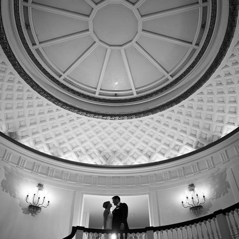 bride and groom embracing in the Hudson room