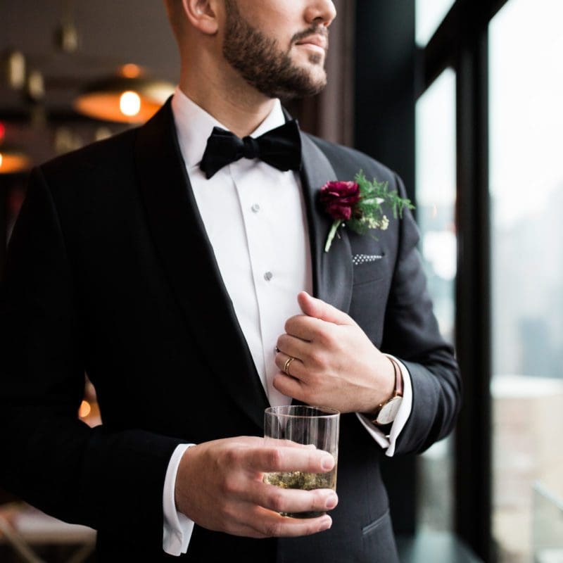 groom holding drink