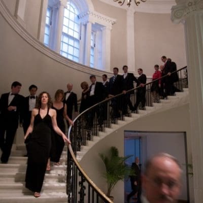 guests walking down a grande staircase