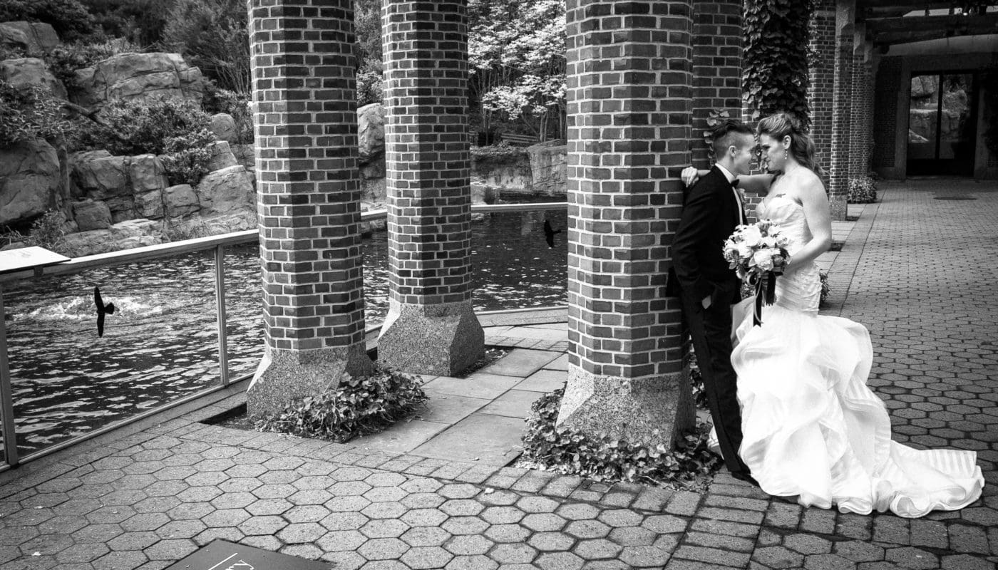 bride and groom embracing outside