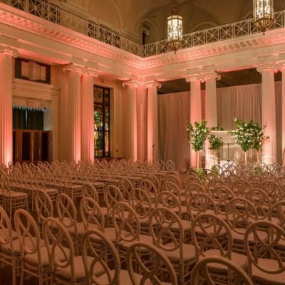 Chairs arranged in a room for a wedding ceremony