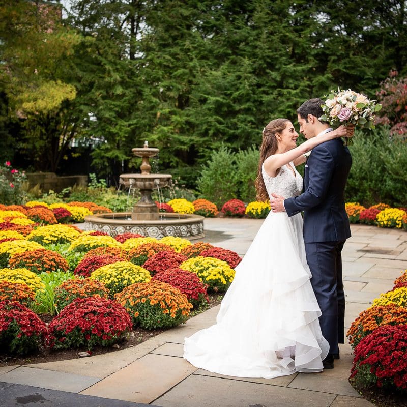 Hudson Room fountain and garden with bride and groom