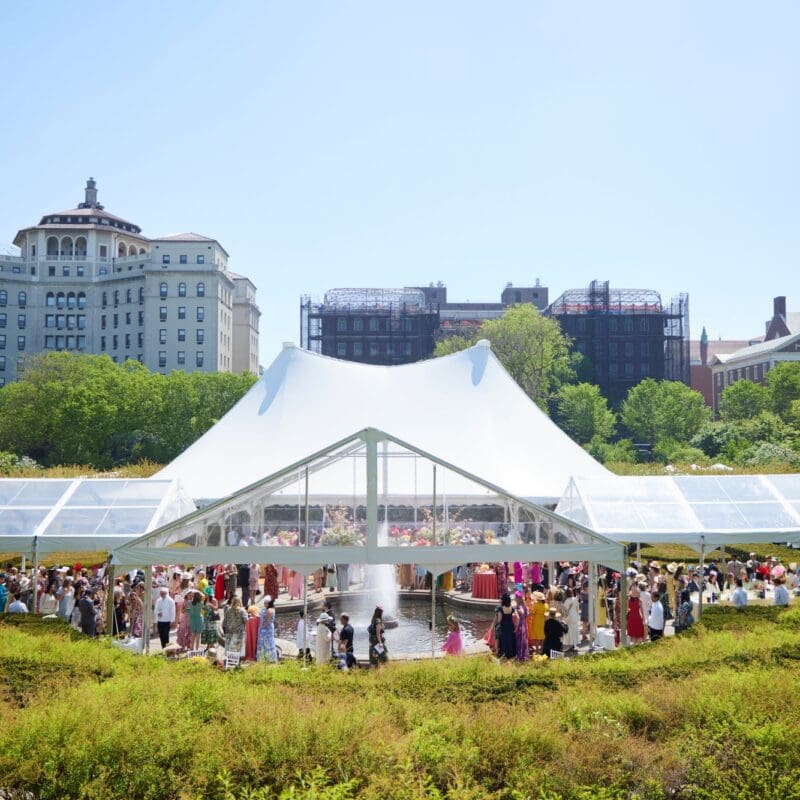 Central Park Conservancy Hat Luncheon event under a tent.