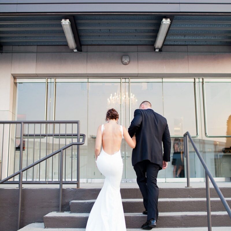 exterior image of venue with bride and groom