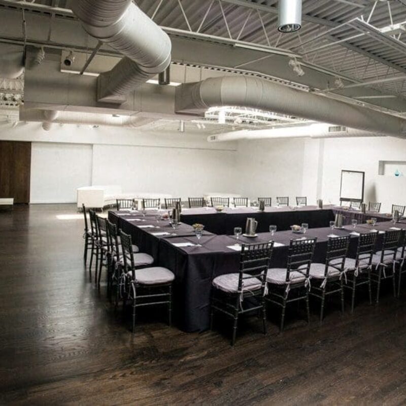 interior venue area with a large square table