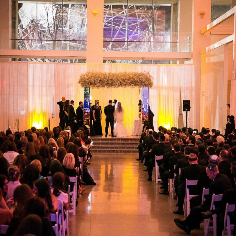 bride and groom embracing at altar