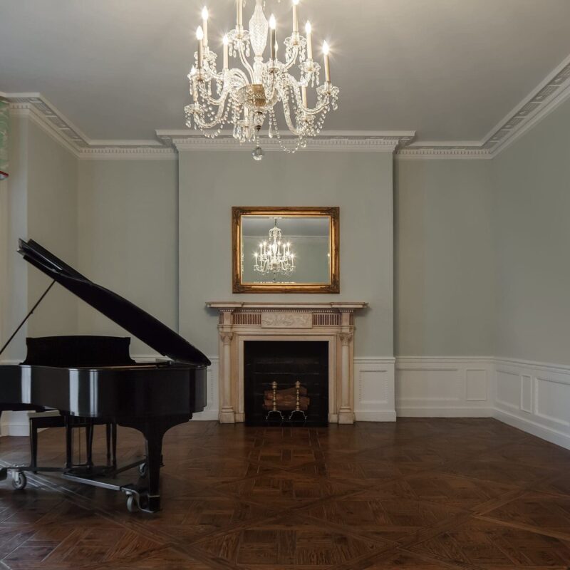 piano next to fireplace