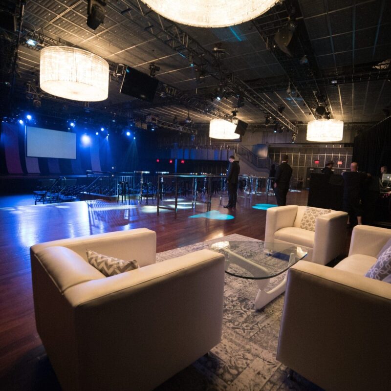 large interior event space with lounge area and dining tables