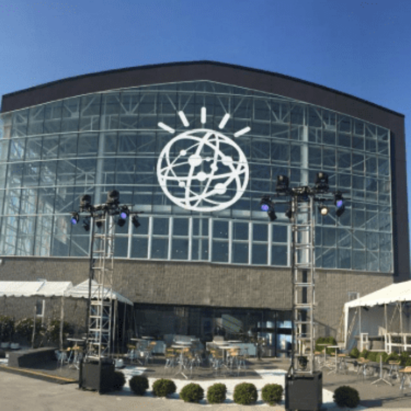 large glass building with an outdoor event