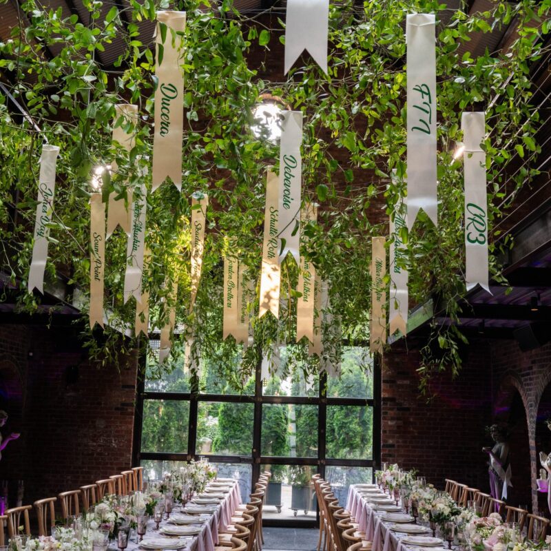 The Foundry venue set up with two long dinner tables for an evening event.