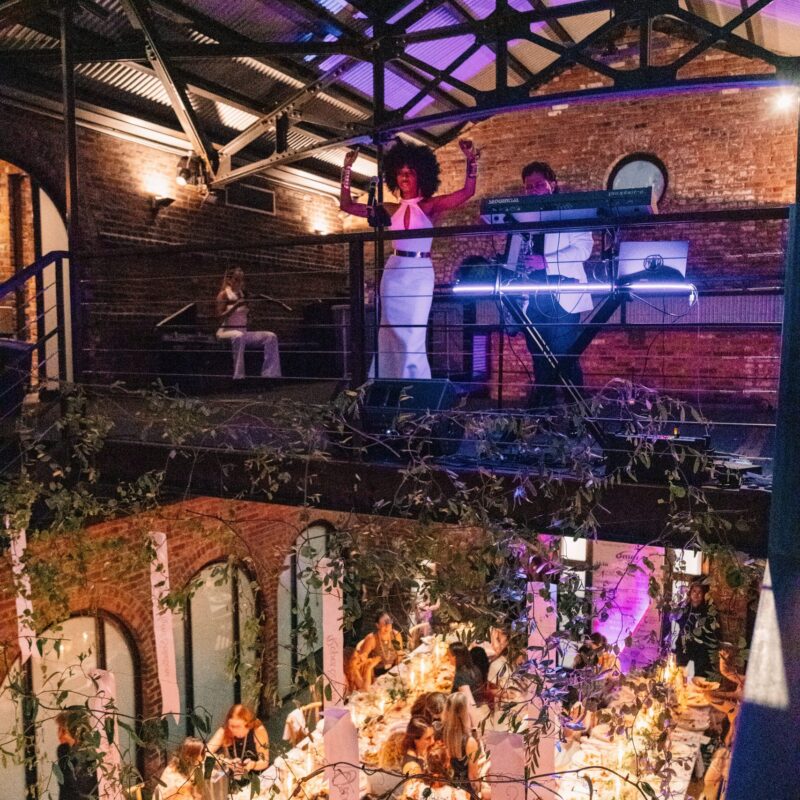Band performing above guests at The Foundry