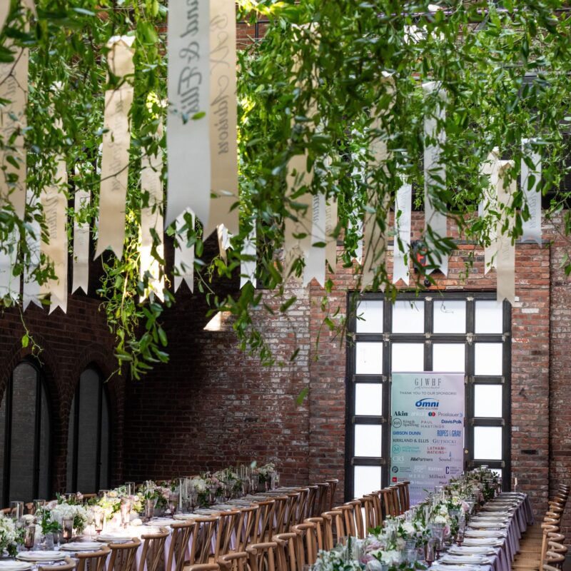 The Foundry venue set up with two long dinner tables for an evening event.